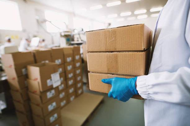 istock Closeup of hands full of boxes . 1002413452