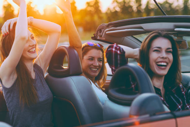 istock Friends on a road trip with cabriolet 1002418042