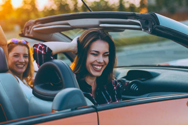 istock Friends on a road trip with cabriolet 1002418242