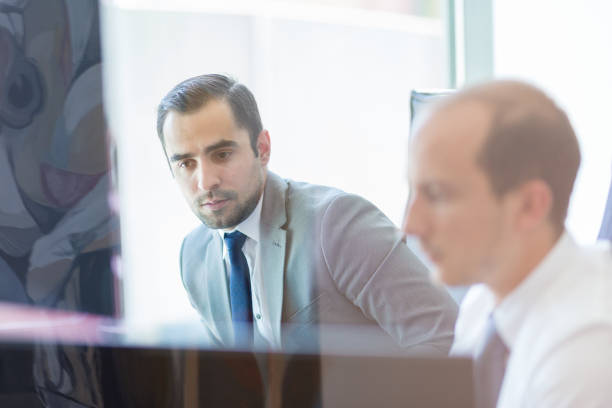 istock Business team analyzing data at business meeting. 1002425864