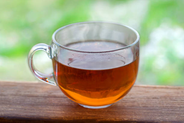 istock Transparent cup of black hot tea 1002426936