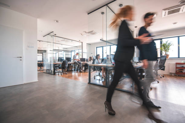 istock Female business professionals discussing in office 1002439630