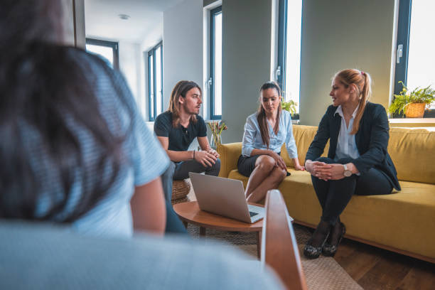 istock Web designers discussing during meeting in lobby 1002439674