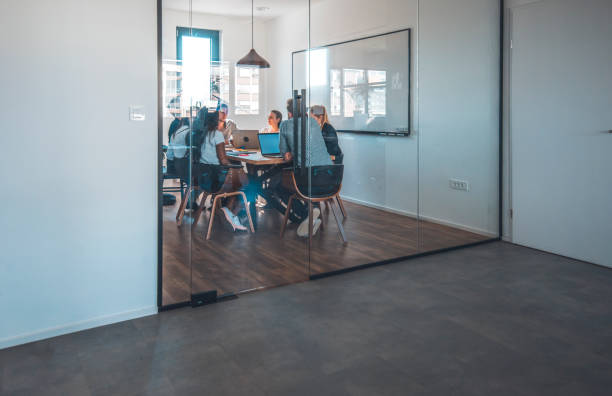 istock Business people discussing in creative office 1002439698