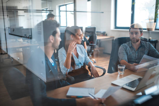 istock Web designers discussing during meeting in office 1002439946