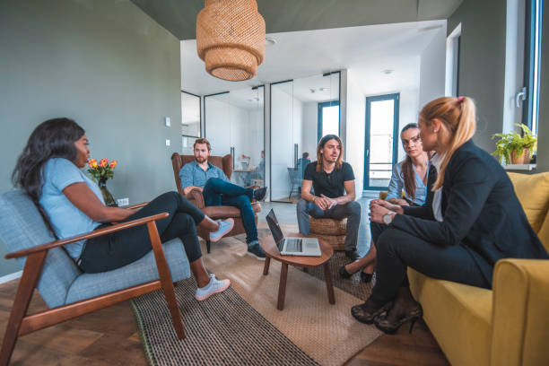istock Web designers discussing in lobby at office 1002439950