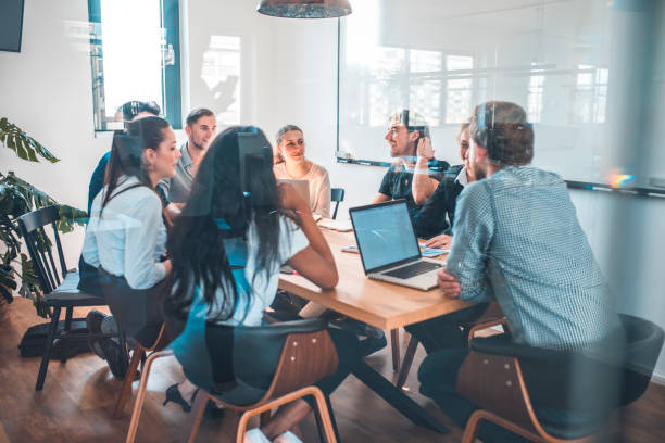 istock Colleagues discussing during meeting in office 1002439954
