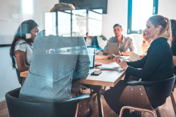 istock Colleagues discussing during meeting in office 1002439968