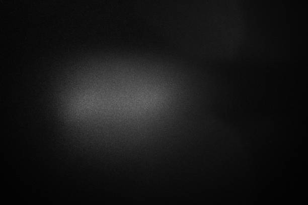 istock black paper texture or background with spotlight, dark wall backdrop wallpaper, dark tone. 1002456146