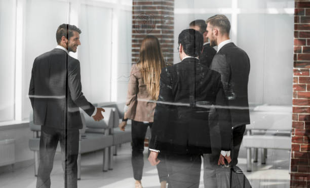 istock Business people from the back - looking at something 1002456484