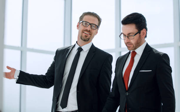 istock Two employees discuss the results of their work 1002456736