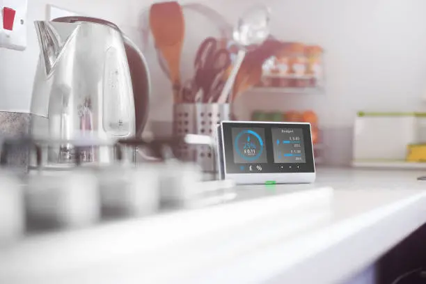 Smart meter in the kitchen of a home showing current energy costs for the day

Design on screen my own. Please see property release.