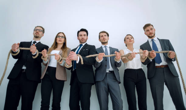 istock Hands of businessmen with a rope 1002461410