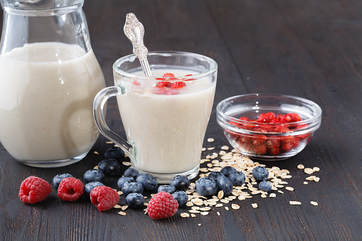 berry smoothie with oatmeal in a glass, healthy eating diet concept