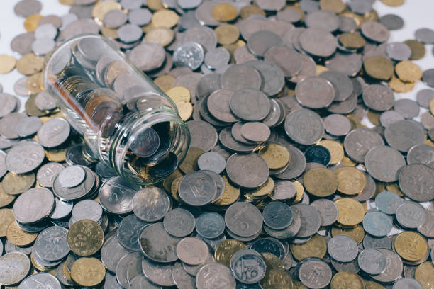 istock High Angle View Of Jar On Coins 1002465792