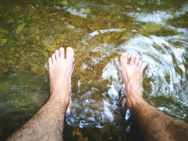 istock Low Section Of Man In Lake 1002466368