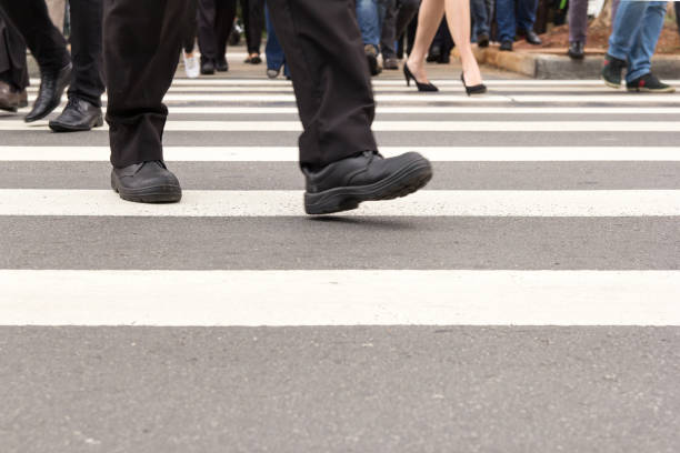 istock Low Section Of Man Walking On Street 1002466454