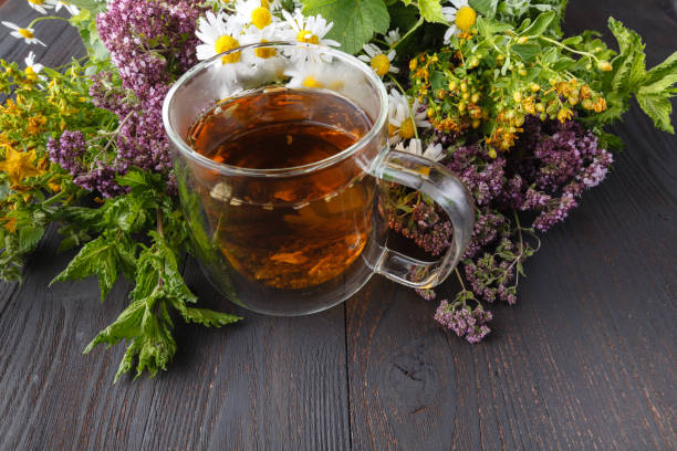 istock Cup of herbal tea with fresh herbs 1002469350
