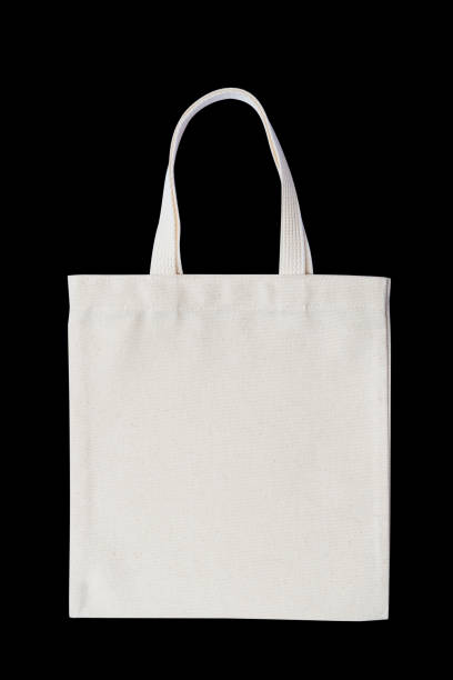 istock Tote bag fabric cloth shopping sack mockup isolated on black background (clipping path) 1002517836