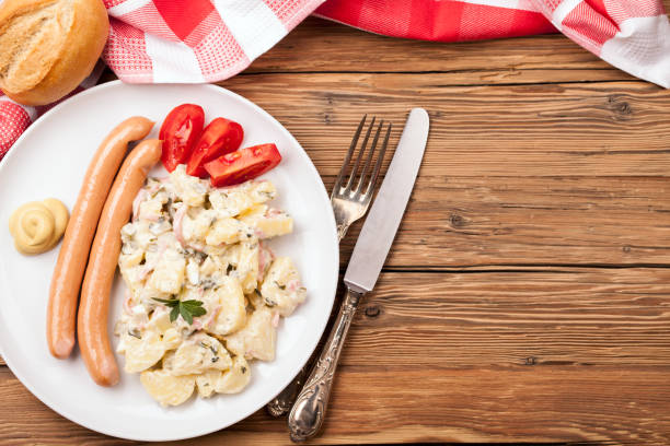 Tasty wurstel  sausages with potato in white background