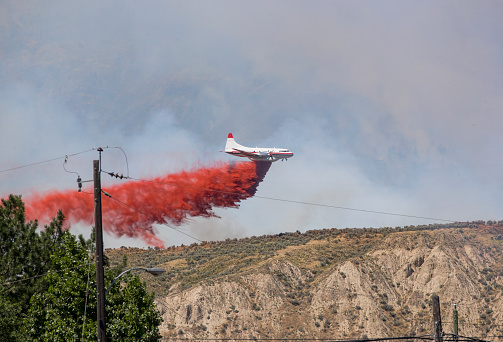 A fire fighting bomber attacks a forest fire. Taken in Kamloops, British Columbia