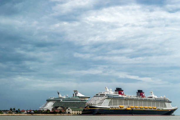 Disney Fantasy and Royal Caribbean Independence of the Seas in Falmouth, Jamaica Falmouth, Jamaica - June 03 2015: Disney Fantasy and Royal Caribbean Independence of the Seas cruise ships docked side by side at the Falmouth Cruise Port in Jamaica. falmouth harbor stock pictures, royalty-free photos & images