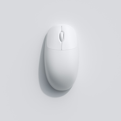 A White computer mouse on white background. top view, flat lay minimal concept.