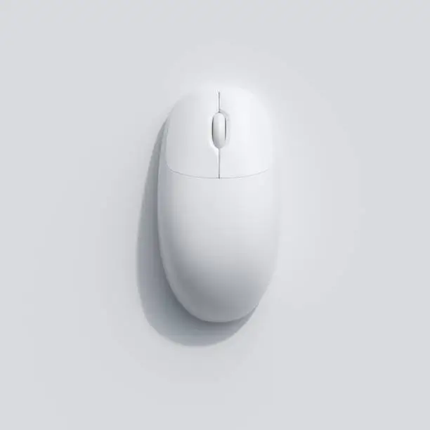 Photo of A White computer mouse on white background. top view, flat lay minimal concept.
