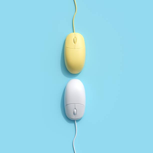 istock Yellow and White Computer mouse on blue background. top view, flat lay minimal concept. 1002544896