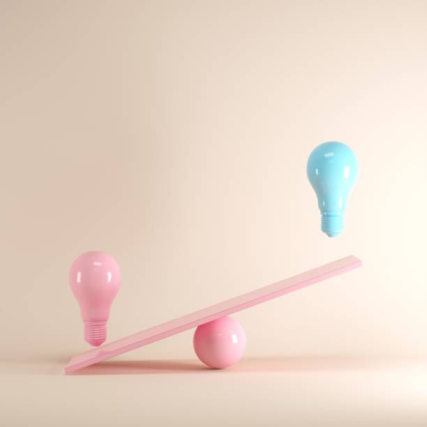 istock Outstanding Blue light bulb floating on pink seesaw, minimal idea concept. 1002545058
