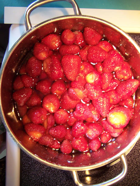 istock Strawberry fruit cooking on the stovetop - abstract art 1002547392