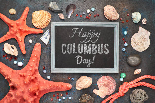 istock Blank blackboard with sea shells, rope and star fish on dark background, text 1002547606