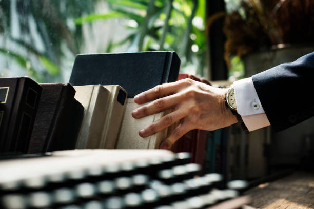 Closeup of hand getting a book