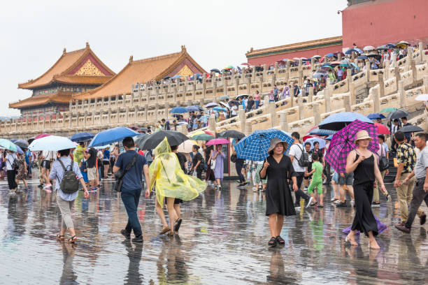 Beijing, China - July 29, 2012: Young Chinese girl with a Chinese Flag in her head at the Forbidden City in the city of Beijing, in China