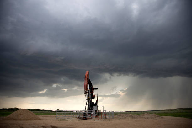 Storm Oil Field Pump Jack stock photo