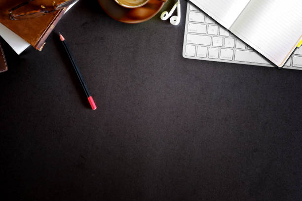 istock Office leather desk table with coffee, gadget and office supplies. Copy space and workspace. 1002567036
