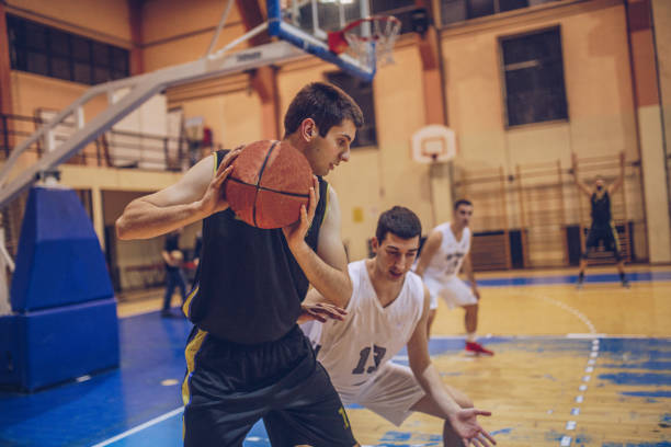 istock Basketball duel under hoop 1002572198