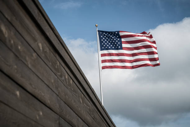 istock Make American Great Again - American Flag at Border Wall 1002572234