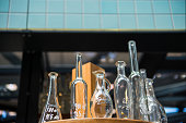 low angle view of glass bottles on blurred background