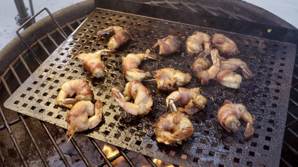istock Bacon Wrapped Jumbo Shrimp or Prawns on a Grill 1002592622