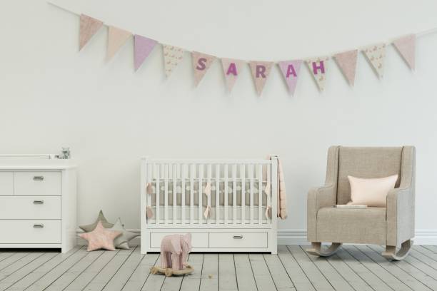 istock modern nursery with decorated Flags with name sarah 1002595392