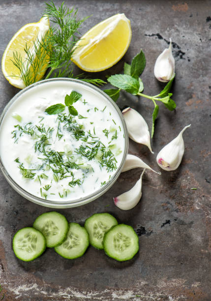 istock Tzatziki sauce ingredients Food background 1002612044