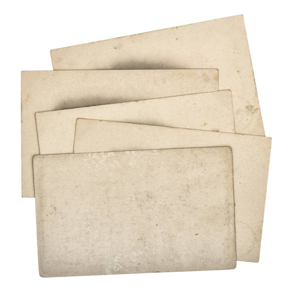 istock Pile used paper cards isolated white background 1002615310