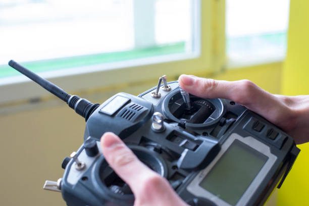 Photo of large radio remote control in the boy's hand