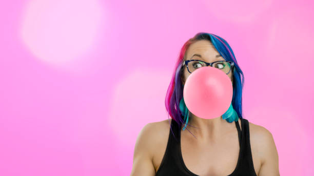 istock Woman with huge gum bubble 1002628662