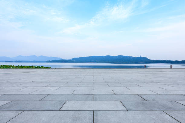 istock square floor and mountain scenery under the blue sky 1002630966