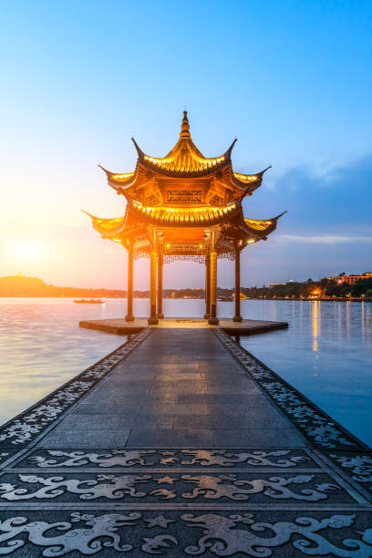 istock Hangzhou west lake jixian pavilion at sunset 1002631412
