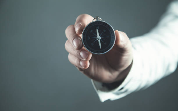 istock Man showing compass. Business concept 1002637360