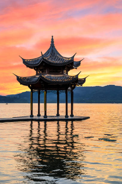 istock Hangzhou west lake jixian pavilion at sunset 1002640580