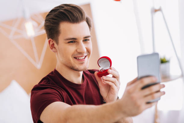 istock Portrait of delighted brunette that taking photo 1002652972